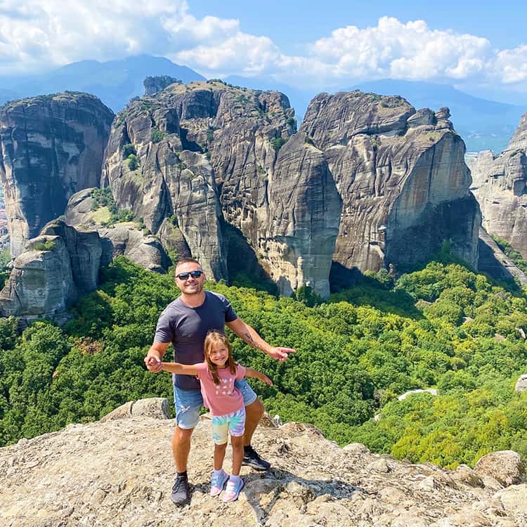 Father and Daughter on the rocky viewpoint at Meteora, Greece