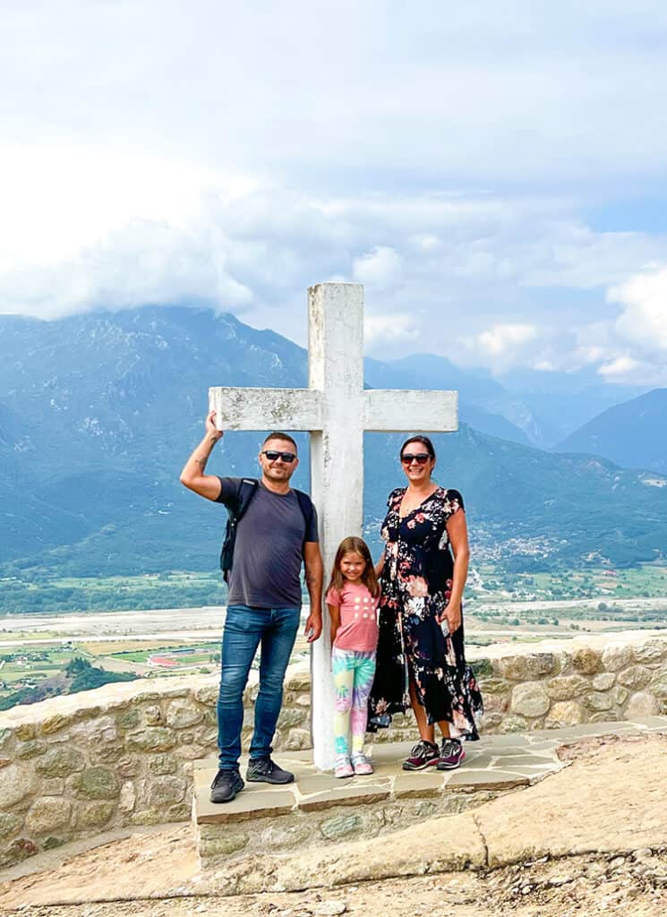 Holy Trinity Monastery Meteora, Greece, family standing at the white cross