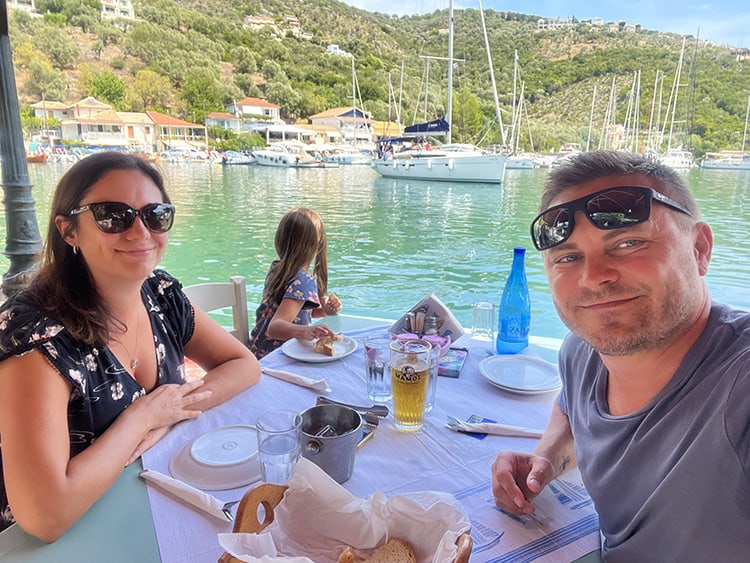 Lunch at Sivota in Lefkada Island in Greece, family eating lunch, water front, boats