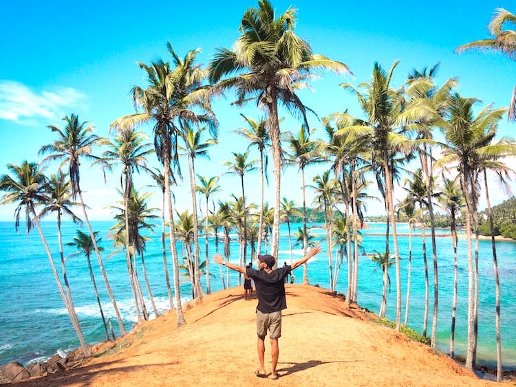 Man Standing at Mirissa Beach, Sri Lanka