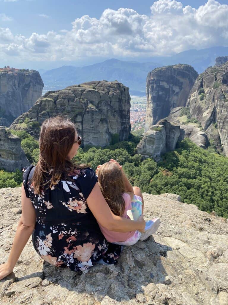 Meteora Monasteries in Greece, Mother and Daughter sitting on the Rock Viewpoint