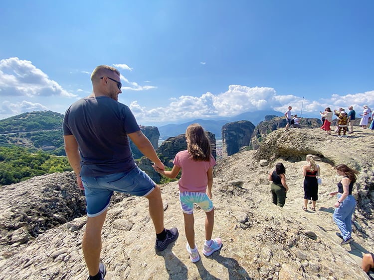 Meteora Monasteries in Greece, Rock Viewpoint, father and daughter and other people