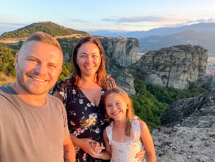 Meteora Monasteries in Greece, Sunset photo of family with monastery in background
