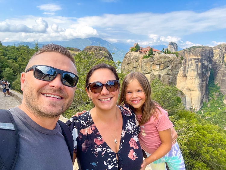 Meteora Monasteries in Greece, family photo with monastery in background