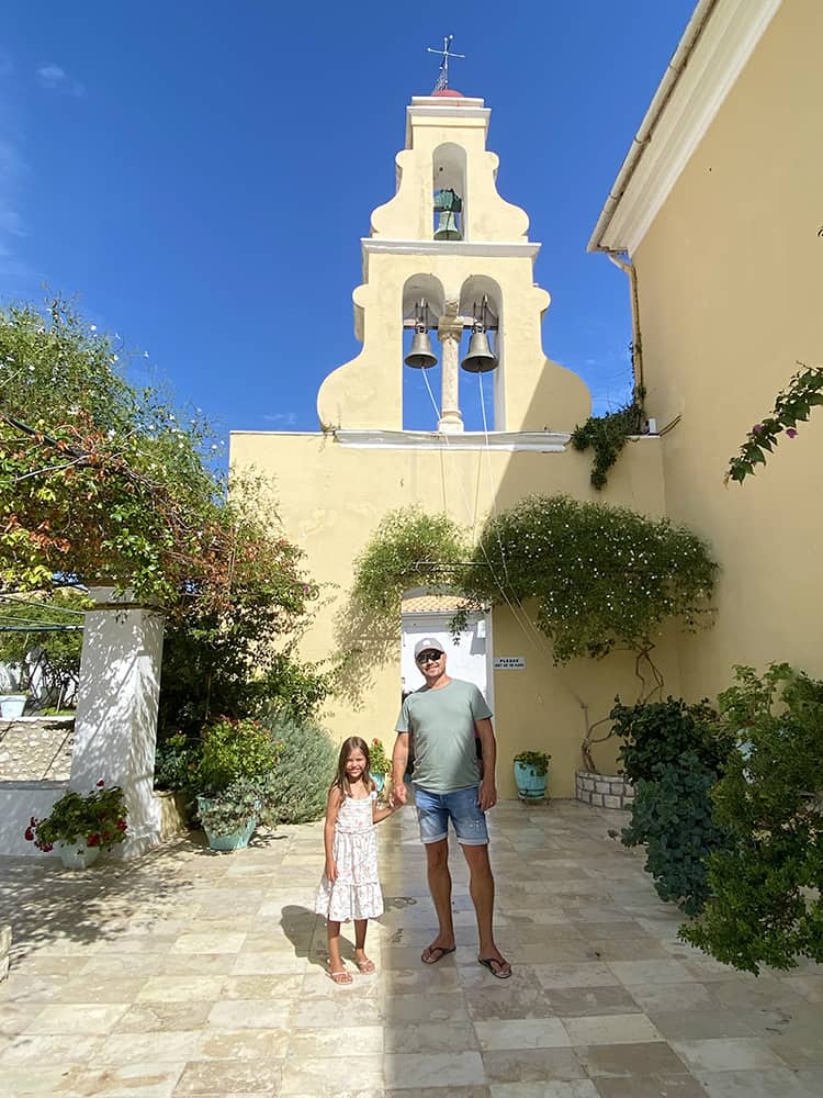 Paleokastritsa Monastery in Corfu, Greece, father and daughter at the monastery
