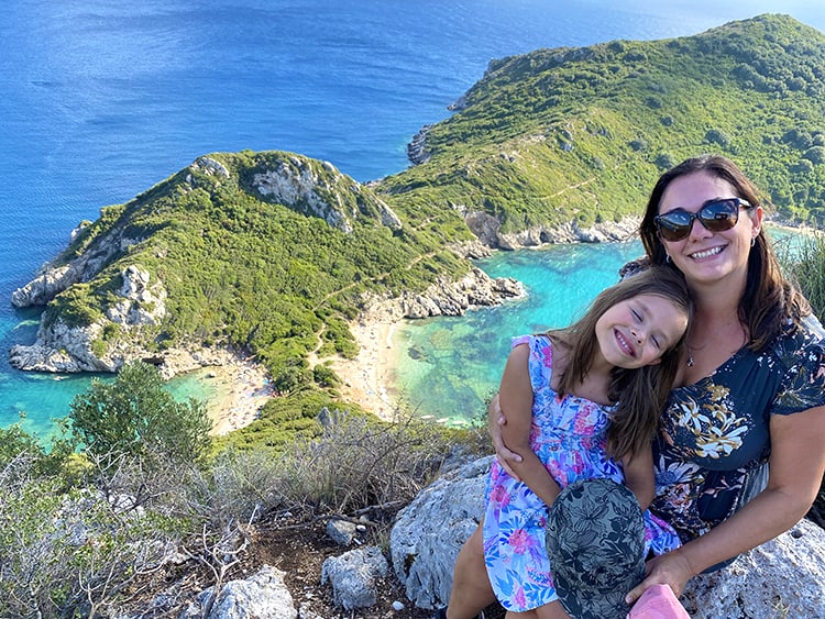 10 Things To Do In Corfu | Top Activities & Sights, Porto Timoni Viewpoint and Beach, Mother and Daughter at the viewpoint beach in the background