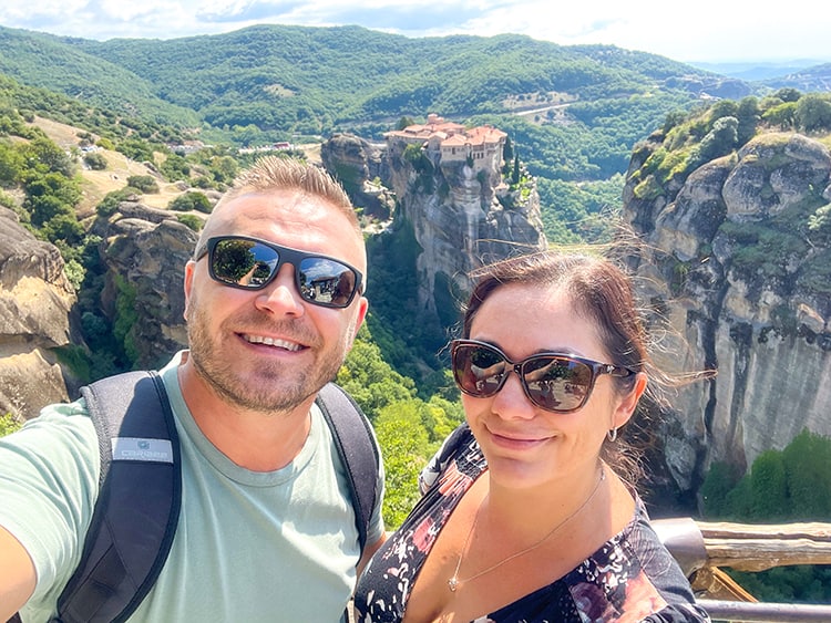 Varlaam Monastery Meteora, Greece, a couple selfie photo with monastery in the background