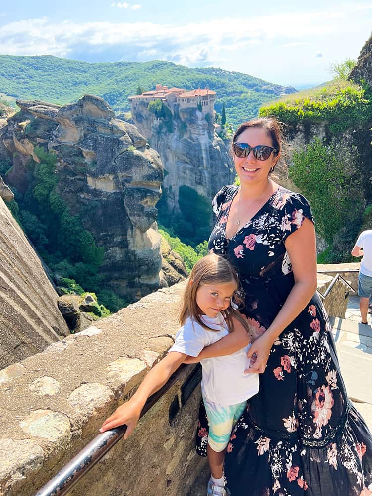 Varlaam Monastery Meteora, Greece,  mother and daughter with the monastery in the background