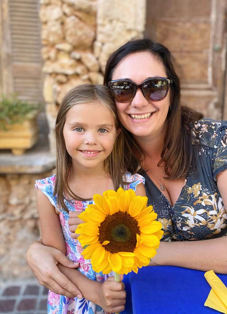 Best places to visit in Crete, Greece, Chania Old Town, Turkish Quarter, Mother and daughter with a flower
