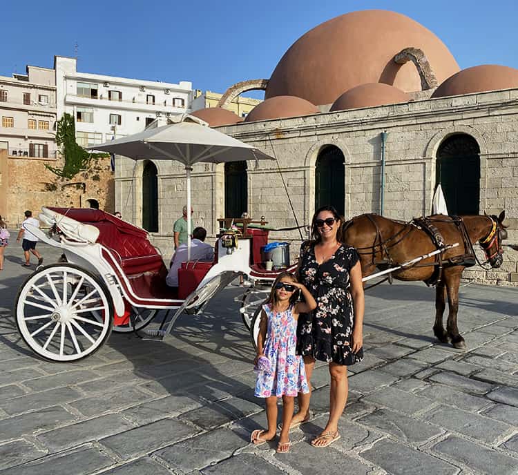 Family Holiday to Crete in Greece, Chania Venetian Harbour, mother and daughter, horse carriage, church
