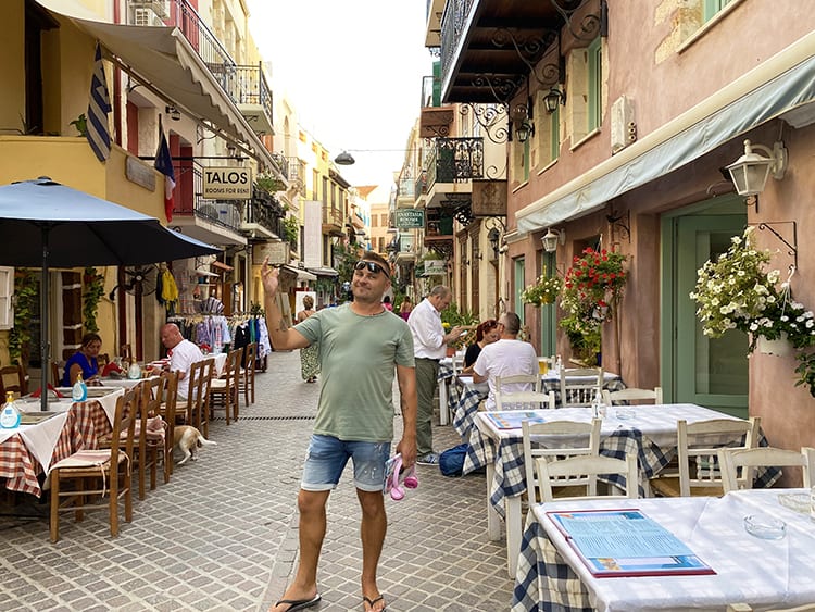 Family holiday in Crete, Greece, Chania Old Town, man in the alley, restaurants