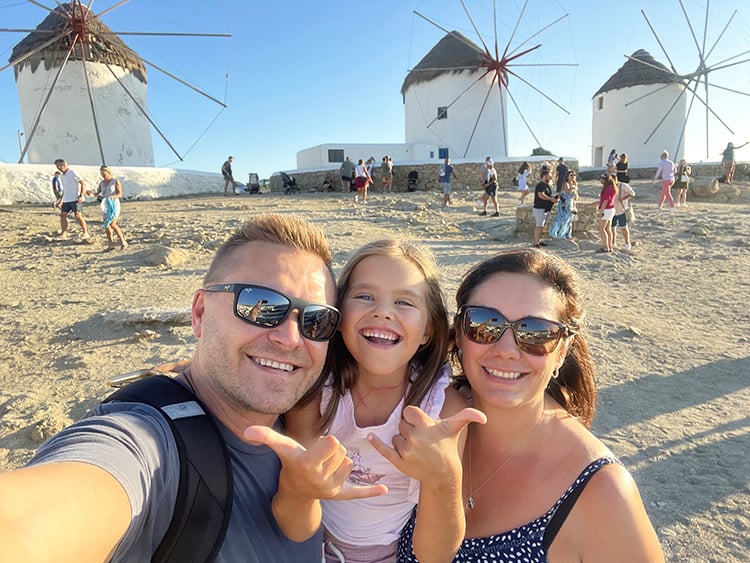 Mykonos in September, Greece - Family in front of the Mykonos Windmills