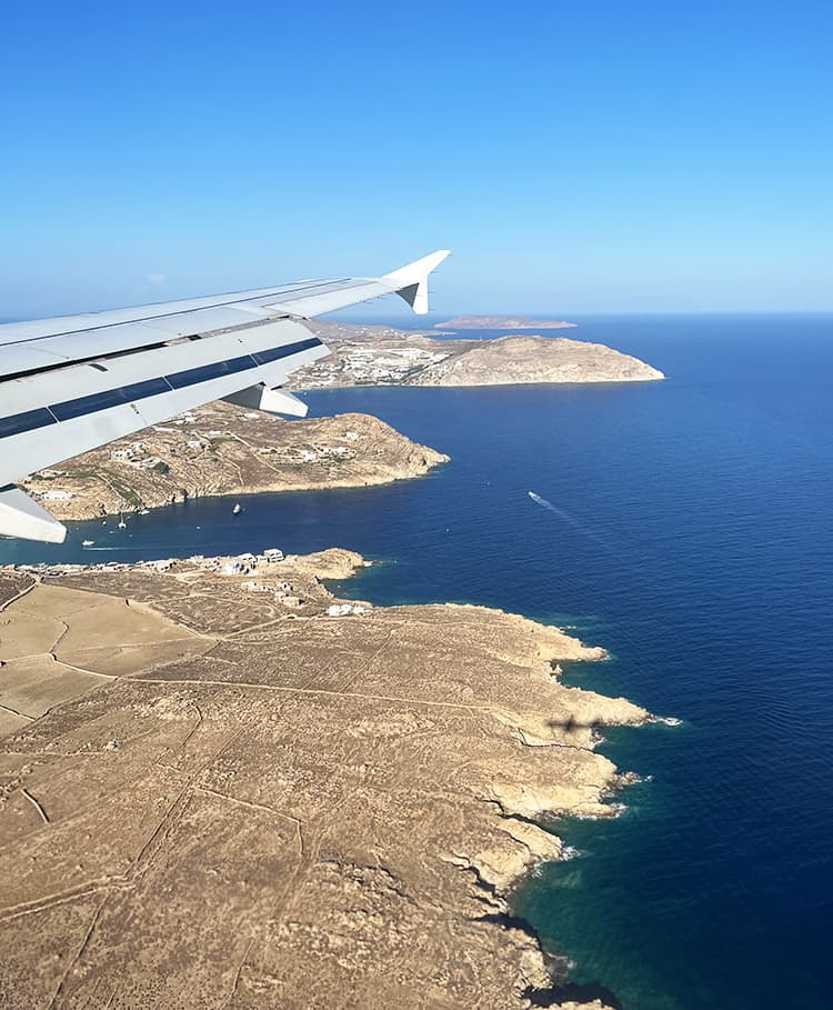 Mykonos in September, Greece - How to get to Mykonos by plane, view of Mykonos from the plane, wing of the plane