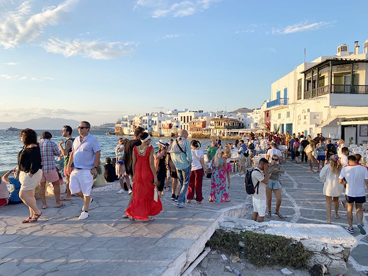 Mykonos in September, Greece -  Tourists in front of Little Venice and restaurants