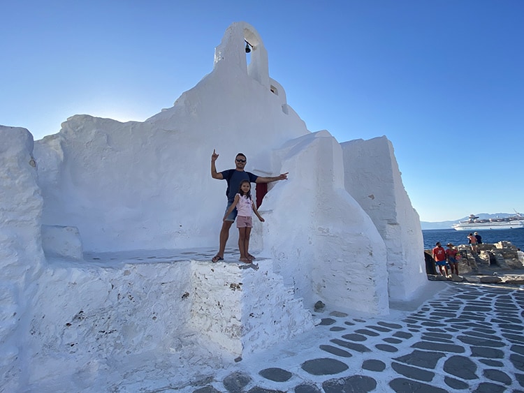 Mykonos in September, Greece - White Buildings of Mykonos, father and daughter