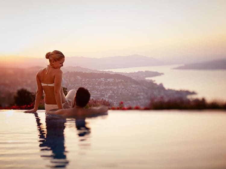 Panorama Resort and Spa, couple in the infinity pool, sunset view