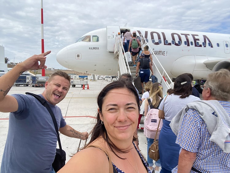 Santorini in September, Greece - a couple about to board a Volotea Airplane