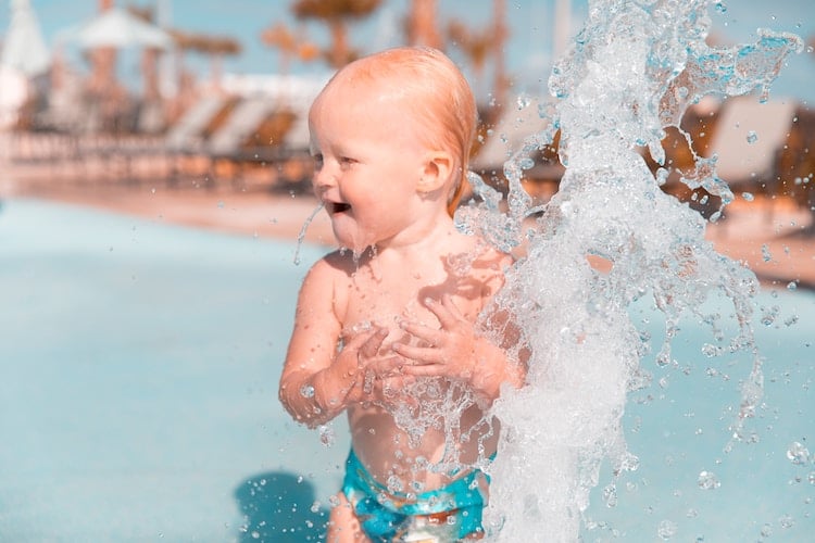 Baby Splashing in Water at waterpark