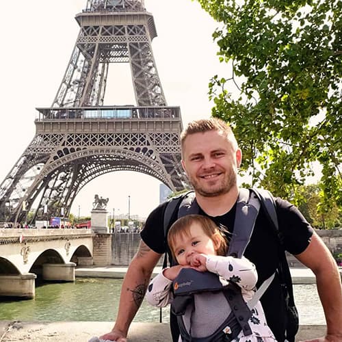 Best eSIM for Europe Travel - Andrzej Ejmont standing in front of Eiffel Tower