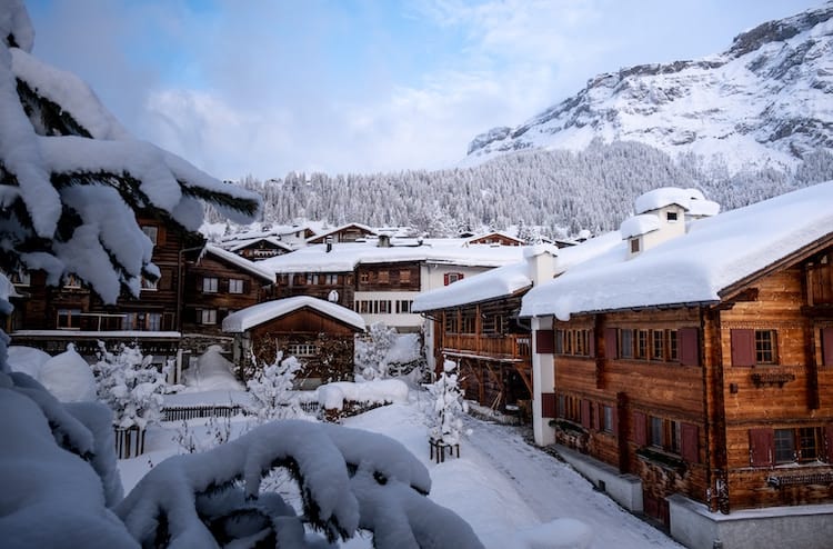 Switzerland Mountain Chalets covered with Winter Snow
