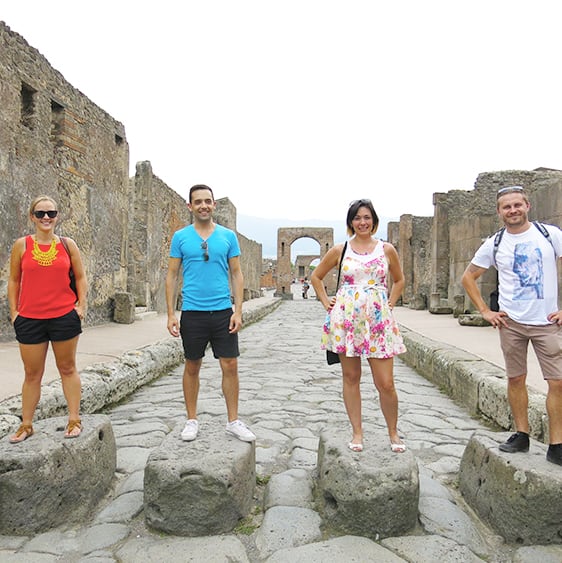Best Pompeii Day Trips from Rome, people posing in the street in Pompeii