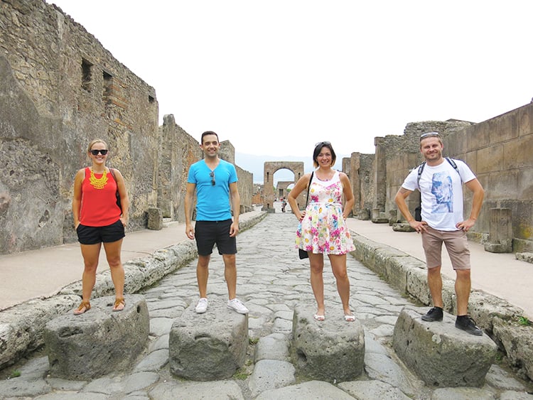 Best Pompeii Day Trips from Rome, people posing in the street in Pompeii