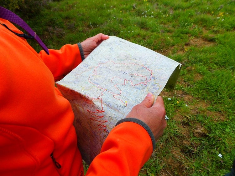 Day Hiking Essentials using a map for orientation