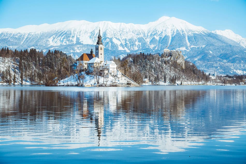 Lake Bled with Bled Island and Castle at sunrise in winter, Slov
