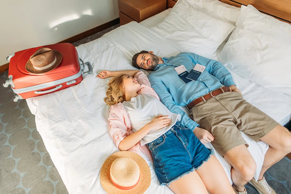 Hotel room with couples on bed