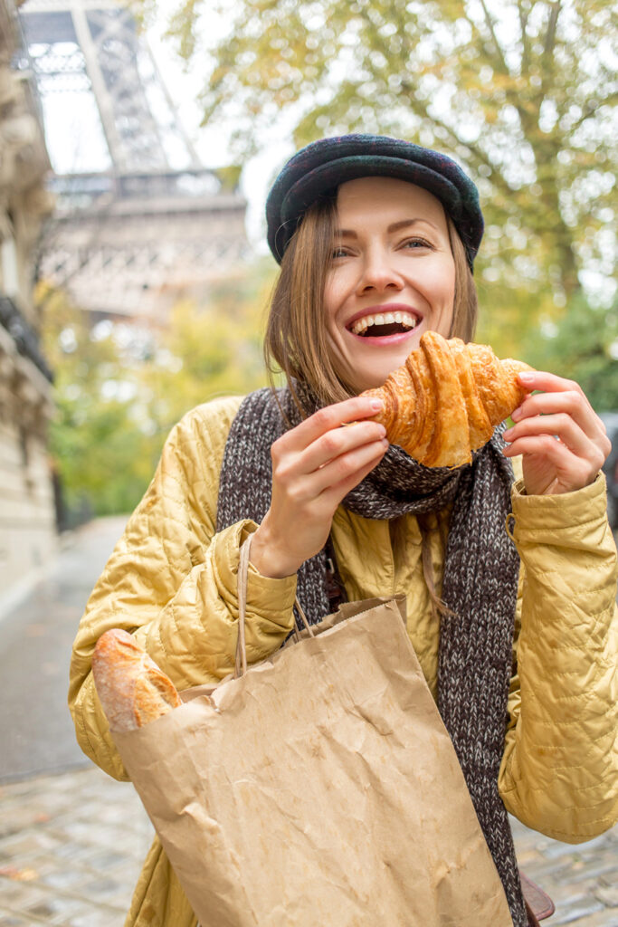 Paris, France eating a croissant