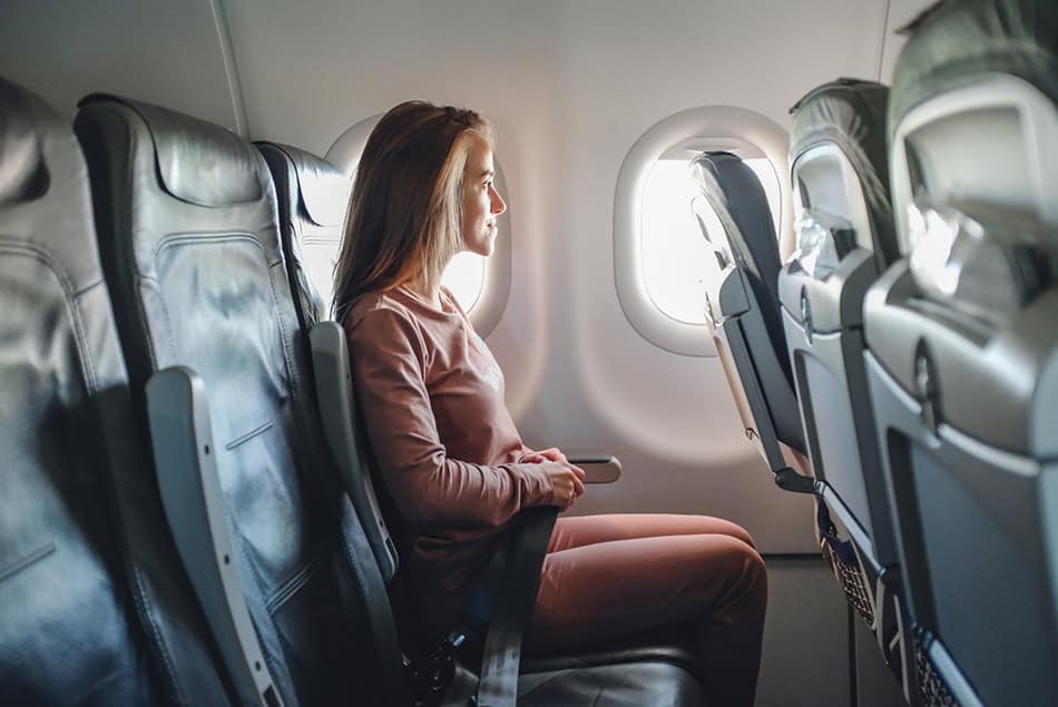 Girl on a plane flight in comfy clothes