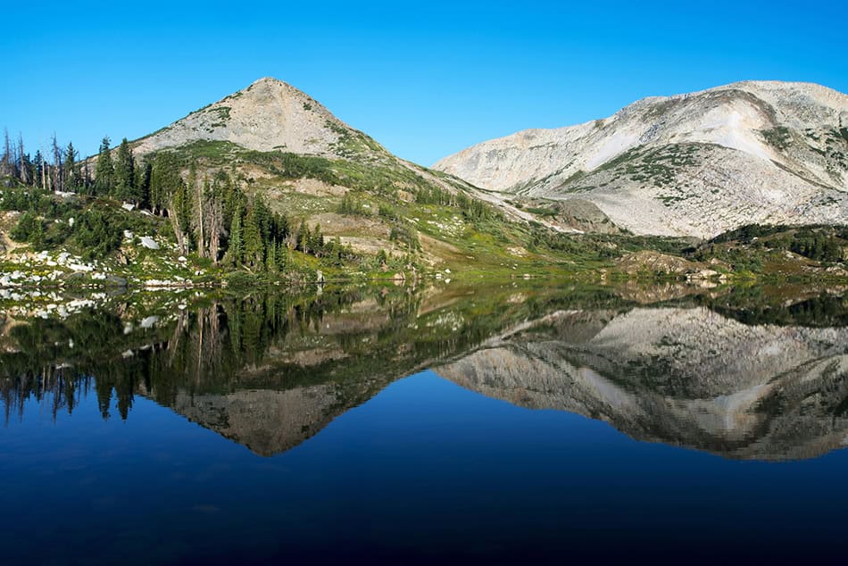 Sugarloaf Mountain and Medicine Bow Peak reflected in Libby Lake in Medicine Bow National Forest in Wyoming USA